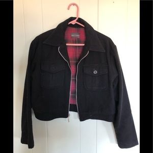 Black two pocket dressy girls fleece jacket.